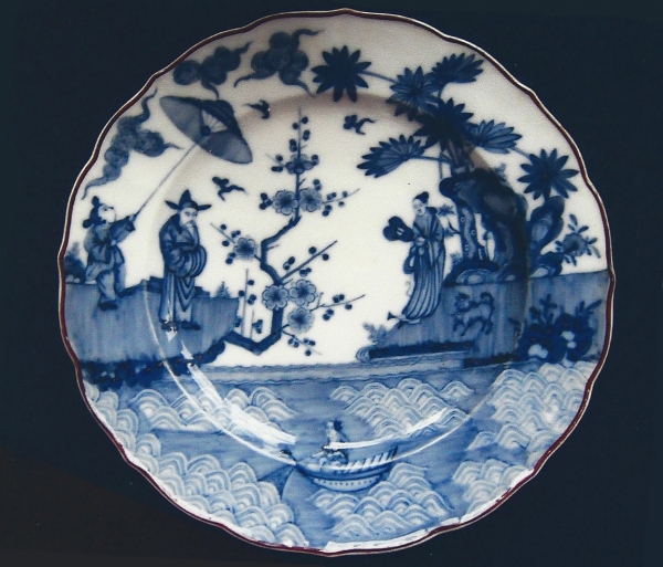 A Dutch blue and white porcelain plate, decorated with a landscape after a Japanese example