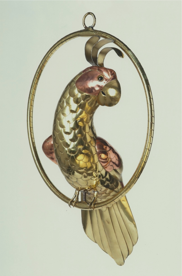 A brass figure of a cockatoo